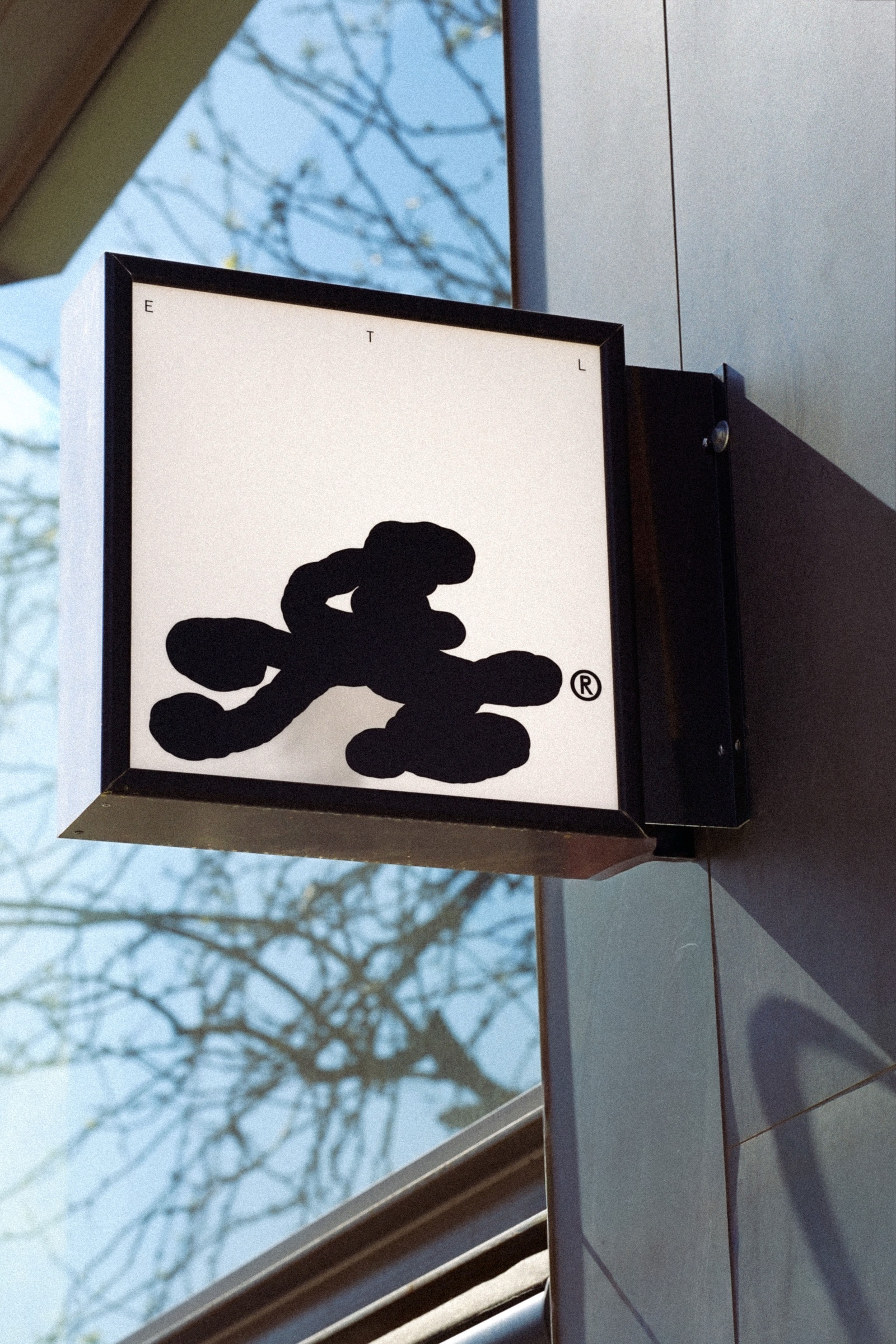ETL lightbox sign on Carrer d'Ausiàs Marc, encrypted blob mark glowing at night.